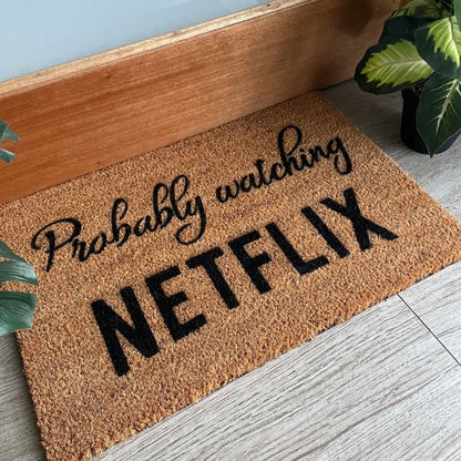 Probably watching Netflix doormat