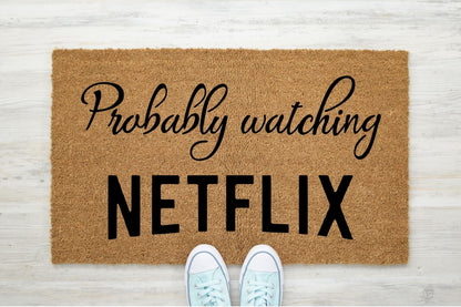 Probably watching Netflix doormat
